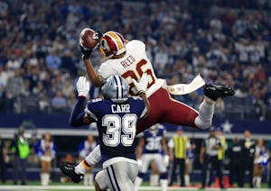 Dallas Cowboys cornerback Brandon Carr (39) defends as Washington Redskins tight end Jordan Reed (86) catches a touchdown pass in the end zone in the second half of an NFL football game, Thursday, Nov. 24, 2016, in Arlington, Texas. (AP Photo/Ron Jenkins)