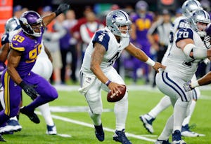 Dallas Cowboys quarterback Dak Prescott (4) is forced out of the pocket by the Minnesota Vikings during the second quarter at U.S. Bank Stadium in Minneapolis, Minnesota, Thursday, December 1, 2016. (Tom Fox/The Dallas Morning News)