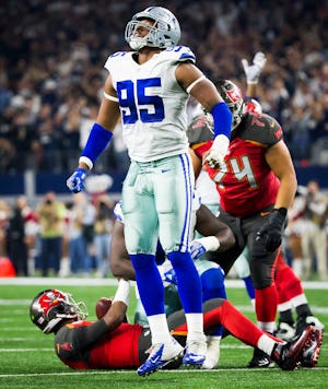Dallas Cowboys defensive tackle David Irving (95) celebrates after sacking Tampa Bay Buccaneers quarterback Jameis Winston (3) during the fourth quarter of an NFL football game at AT&T Stadium on Sunday, Dec. 18, 2016, in Arlington. The Cowboys won the game 26-20. (Smiley N. Pool/The Dallas Morning News)
