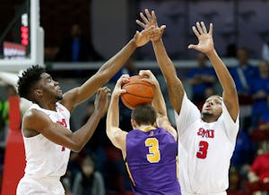 Albany guard Joe Cremo (center) is defended by SMU guard Shake Milton (left) and guard Sterling Brown during the second half at Moody Coliseum in Dallas, Tuesday, Dec. 20, 2016. The Mustangs won 71-53. (Jae S. Lee/The Dallas Morning News)