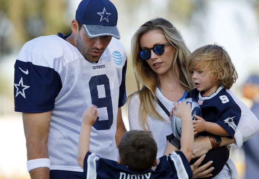 Dallas Cowboys quarterback Tony Romo (9) and his wife  Candice Crawford corral their kids Hawkins (left) and Rivers following afternoon practice at training camp in Oxnard, California, Friday, August 5, 2016. (Tom Fox/The Dallas Morning News)