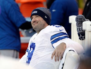 FILE - In this Jan. 1, 2017, file photo, Dallas Cowboys' Tony Romo smiles on the bench during the second half of an NFL football game against the Philadelphia Eagles in Philadelphia. Those closest to Romo on the Cowboys arenât ready to discuss the future of the Dallas quarterback, probably because they know the likely final answer. After 156 games, 34,183 yards passing and 248 touchdowns, Romoâs career in Dallas appears over after he lost the job he held for 10 years to rookie sensation Dak Prescott following a preseason back injury. The question is, whatâs next. (AP Photo/Matt Rourke, File)