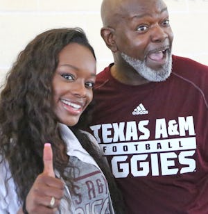 Dallas Cowboys Hall of Famer Emmitt Smith is pictured with his daughter Rheagen Smith as they celebrate her signing a  national letter of intent to play soccer for Texas A&M, at the Greenhill School's signing day ceremony in Addison, Texas, on Wednesday, February 1, 2017. (Louis DeLuca/The Dallas Morning News)