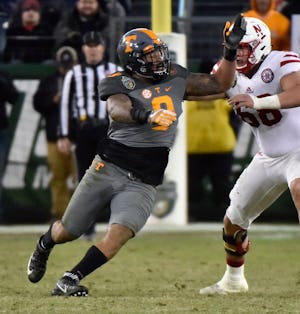 NASHVILLE, TN - DECEMBER 30: Derek Barnett #9 of the University of Tennessee Volunteers rushes toward the quarterback of the Nebraska Cornhuskers during the second half of the Franklin American Mortgage Music City Bowl at Nissan Stadium on December 30, 2016 in Nashville, Tennessee. (Photo by Frederick Breedon/Getty Images)