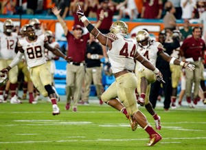 Florida State defensive end DeMarcus Walker (44) celebrates after blocking a field goal during the second half of an NCAA college football game against Miami, Saturday, Oct. 8, 2016, in Miami Gardens. Florida State defeated Miami 201-19. (AP Photo/Wilfredo Lee)