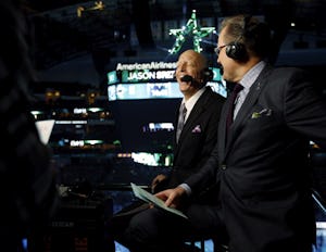 Dallas Stars play-by-play Dave Strader (left) shares a laugh with broadcast partner Daryl Razor Reaugh before a game between the Dallas Stars and Tampa Bay Lightning at American Airlines Center in Dallas on Saturday, February 18, 2017. Strader has been battling bile duct cancer and this is his first game back since last season. (Vernon Bryant/The Dallas Morning News)