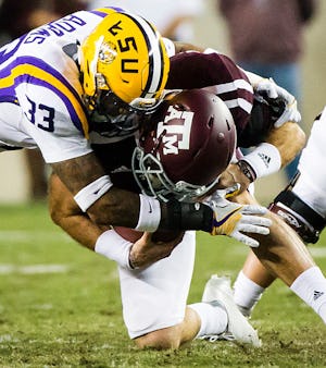 Texas A&M quarterback Trevor Knight (8) is sacked by LSU safety Jamal Adams (33) during the first quarter of an NCAA football game at Kyle Field on Thursday, Nov. 24, 2016, in College Station, Texas (Smiley N. Pool/The Dallas Morning News)