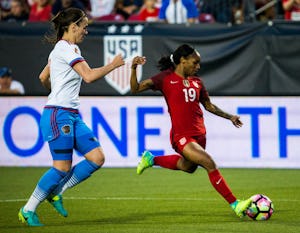 U.S. forward Crystal Dunn (19) takes a shot at goal during the first half of a friendly soccer game between the U.S. Women's National Team and the Russia Women's National Team on Thursday, April 6, 2017 at Toyota Stadium in Frisco, Texas. At left is Russia defender Daria Makarenko (8). Dunn scored a goal in the tenth minute of play. (Ashley Landis/The Dallas Morning News)