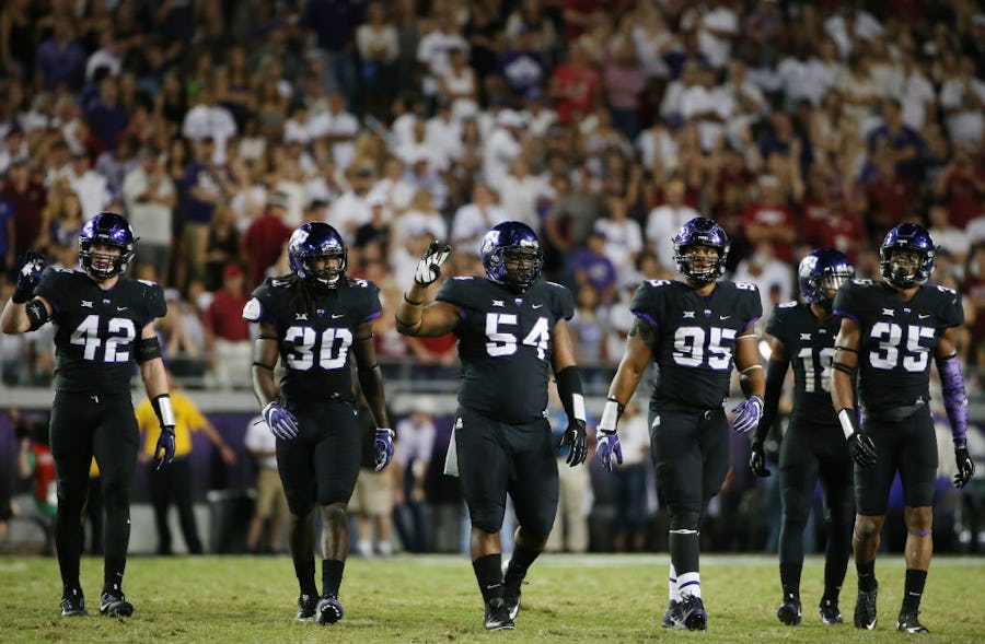 TCU players between plays during an NCAA football game between the Arkansas Razorbacks and the TCU Horned Frogs at Amon G. Carter Stadium in Fort Worth, Texas Saturday September 10, 2016. Arkansas defeated TCU 41-38 in double overtime. (Andy Jacobsohn/The Dallas Morning News)