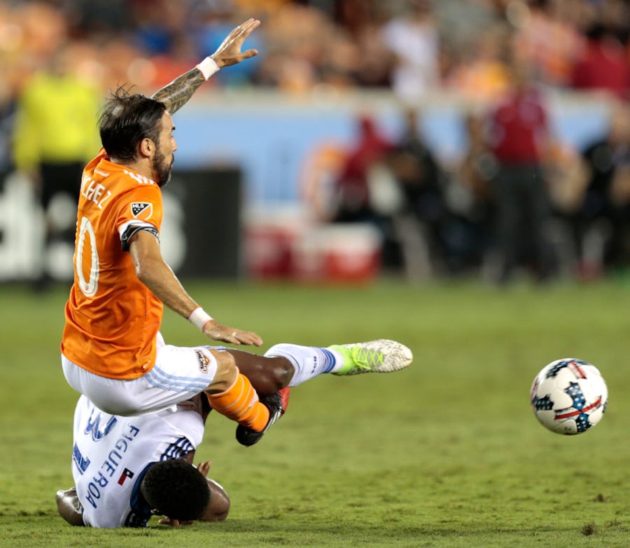 Houston Dynamo forward Vicente Sanchez (10) and FC Dallas defender Maynor Figueroa (31) become entangled while going for the ball during the second half of an MLS soccer game Friday, June 23, 2017, in Houston. (Brett Coomer/Houston Chronicle via AP)
