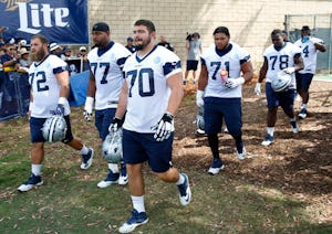 Dallas Cowboys center Travis Frederick (72), Dallas Cowboys tackle Tyron Smith (77), Dallas Cowboys guard Zack Martin (70), Dallas Cowboys offensive guard La'el Collins (71) make their way to the field for the afternoon practice at training camp in Oxnard, California on Monday, July 24, 2017. (Vernon Bryant/The Dallas Morning News)