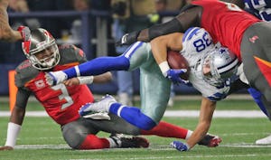 Dallas Cowboys strong safety Jeff Heath (38) is brought down after intercepting a pass from Tampa Bay Buccaneers quarterback Jameis Winston (3) during the Tampa Bay Buccaneers vs. the Dallas Cowboys NFL football game at AT&T Stadium in Arlington, Texas on Sunday, December 18, 2016. (Louis DeLuca/The Dallas Morning News)
