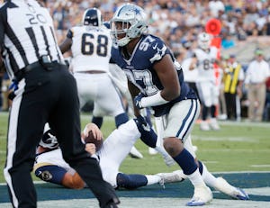 Dallas Cowboys defensive end Taco Charlton (97) gets up after sacking Los Angeles Rams quarterback Sean Mannion (14) during the first half of play in a preseason game between the Dallas Cowboys and Los Angeles Rams at Los Angeles Memorial Coliseum in Los Angeles, California on Saturday, August 12, 2017. (Vernon Bryant/The Dallas Morning News)