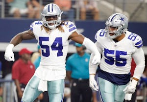 Dallas Cowboys outside linebacker Jaylon Smith (54) celebrates next to Dallas Cowboys defensive tackle Stephen Paea (55) after tackling Indianapolis Colts tight end Jack Doyle (84) on a third down play forcing them to punt during the first half of a preseason game at AT&T Stadium in Arlington on Saturday, August 19, 2017. (Vernon Bryant/The Dallas Morning News)