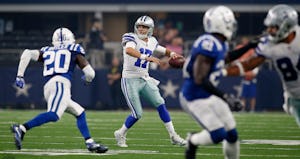 Dallas Cowboys quarterback Kellen Moore (17) is pressured by Indianapolis Colts free safety Darius Butler (20) during the first half at AT&T Stadium in Arlington, Texas, on Saturday, Aug. 19, 2017. (Brad Loper/Fort Worth Star-Telegram/TNS)
