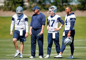 Dallas Cowboys quarterbacks coach Wade Wilson (second from left) is pictured with his players from left, rookie Cooper Rush (7), Kellen Moore (17) and Dak Prescott (4) during organized team activities at The Star in Frisco, Texas, Wednesday, May 24, 2017. (Tom Fox/The Dallas Morning News)