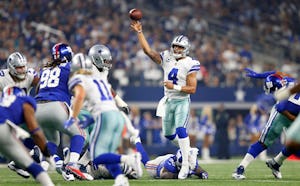 Dallas Cowboys quarterback Dak Prescott (4) throws a first half pass to wide receiver Cole Beasley (11) against the New York Giants at AT&T Stadium in Arlington, Texas, Sunday, September 10, 2017. (Tom Fox/The Dallas Morning News)