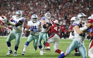 Dallas Cowboys running back Ezekiel Elliott (21) scores a rushing touchdown on an 8-yard run in the fourth quarter during a National Football League game between the Dallas Cowboys and the Arizona Cardinals at University of Phoenix Stadium in Glendale, Arizona on Monday September 25, 2017. The Dallas Cowboys beat the Arizona Cardinals 28-17. (Andy Jacobsohn/The Dallas Morning News)