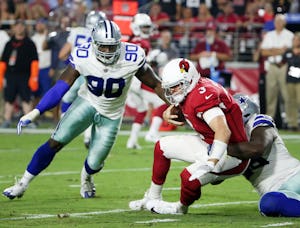 Cowboys defensive tackle Maliek Collins (96) sacks Arizona Cardinals quarterback Carson Palmer (3) with DeMarcus Lawrence (90) nearby during a game between the Cowboys and Cardinals at University of Phoenix Stadium in Glendale, Ariz., on Monday, Sept. 25, 2017. (Andy Jacobsohn/The Dallas Morning News)