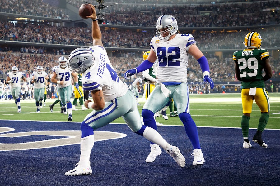 Dallas Cowboys quarterback Dak Prescott (4) spikes the ball after scoring on an 11-yard touchdown run with just over a minute left to play during the second half of an NFL football game against the Green Bay Packers at AT&T Stadium on Sunday, Oct. 8, 2017, in Arlington. The Packers won the game 35-31. (Smiley N. Pool/The Dallas Morning News)