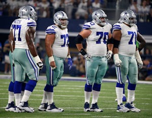 FILE - In this Sept. 10, 2017, file photo, Dallas Cowboys offensive tackle Tyron Smith (77), center Travis Frederick (72), guard Zack Martin (70) and offensive tackle La'el Collins (71) line up against the New York Giants during a game in Arlington. (AP Photo/Michael Ainsworth, File)