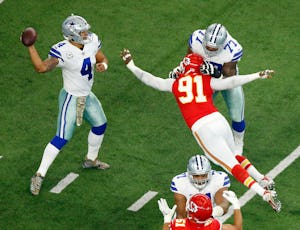 Kansas City Chiefs outside linebacker Tamba Hali (91) reaches for Dallas Cowboys quarterback Dak Prescott (4) on a first quarter pass at AT&T Stadium in Arlington, Texas, Sunday, November 5, 2017. Dallas Cowboys offensive tackle Tyron Smith (77) provided the block. (Tom Fox/The Dallas Morning News)
