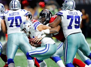 Dallas Cowboys offensive guard Chaz Green (79) tries to keep Atlanta Falcons defensive end Adrian Clayborn (99) from tackling Dallas Cowboys quarterback Dak Prescott (4) in the second quarter at Mercedes-Benz Stadium in Atlanta, Georgia, Sunday, November 12, 2017. Zak escaped the attack. (Tom Fox/The Dallas Morning News)
