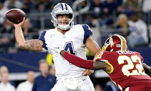 Dallas Cowboys quarterback Dak Prescott (4) throws a pass in the pressure from Washington Redskins strong safety Deshazor Everett (22) during the second quarter at AT&T Stadium in Arlington, Texas, Thursday, Nov. 30, 2017. (Jae S. Lee/The Dallas Morning News)