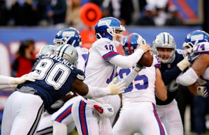 Cowboys defensive end DeMarcus Lawrence (90) pressures New York Giants quarterback Eli Manning (10) during the third quarter of a game at MetLife Stadium in East Rutherford, N.J., on Sunday, Dec. 10, 2017. (Tom Fox/The Dallas Morning News)