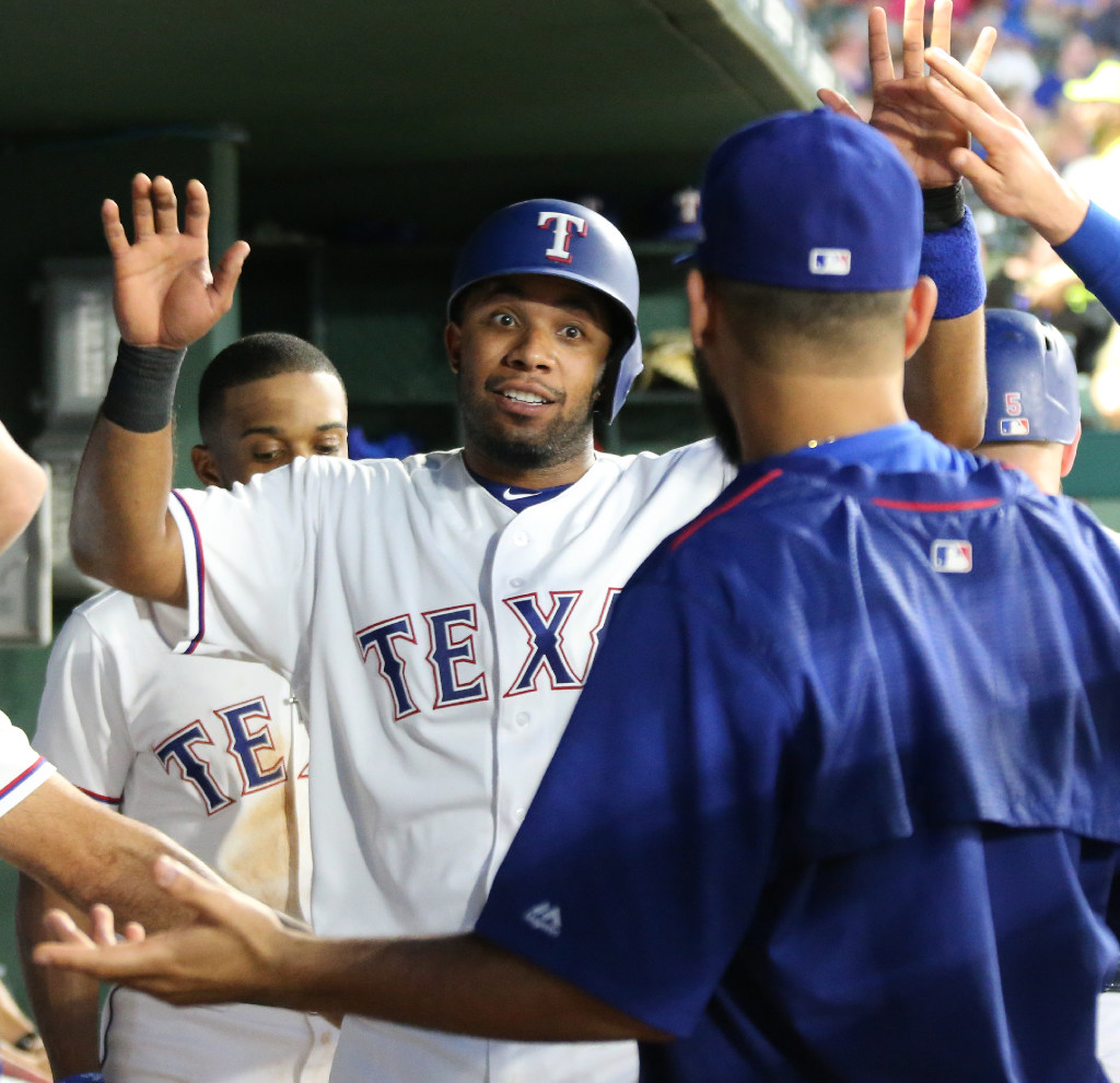 Texas Rangers shortstop Elvis Andrus (1) leaps over Houston Astros