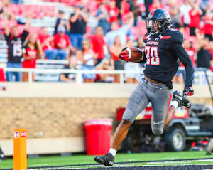 Texas Tech's Adrian Frye (20) returns an interception for a touchdown during an NCAA college football game against Lamar, Saturday, Sept. 8, 2018, in Lubbock, Texas. (John Moore/Lubbock Avalanche-Journal via AP)