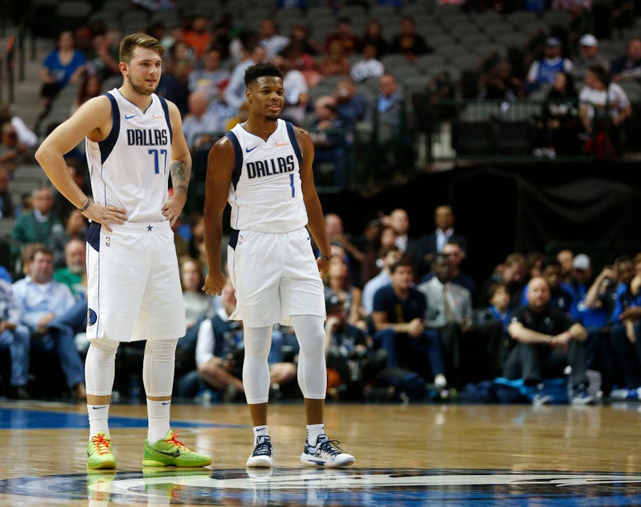 FILE - Mavericks guard/forward Luka Doncic (77) and point guard Dennis Smith Jr. (1) are pictured during a preseason game against Charlotte at American Airlines Center in Dallas on Friday, Oct. 12, 2018. (Vernon Bryant/The Dallas Morning News)