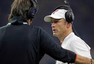 Texas Tech coach Matt Wells, right, talks to special teams coordinator Mark Tommerdahl during an NCAA college football spring game, Saturday, April 13, 2019, in Frisco, Texas. (Brad Tollefson/Lubbock Avalanche-Journal via AP)