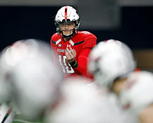 Texas Tech's Alan Bowman (10) calls over Brandt Schilling (80) during an NCAA college football spring game, Saturday, April 13, 2019, in Frisco, Texas. (Brad Tollefson/Lubbock Avalanche-Journal via AP)